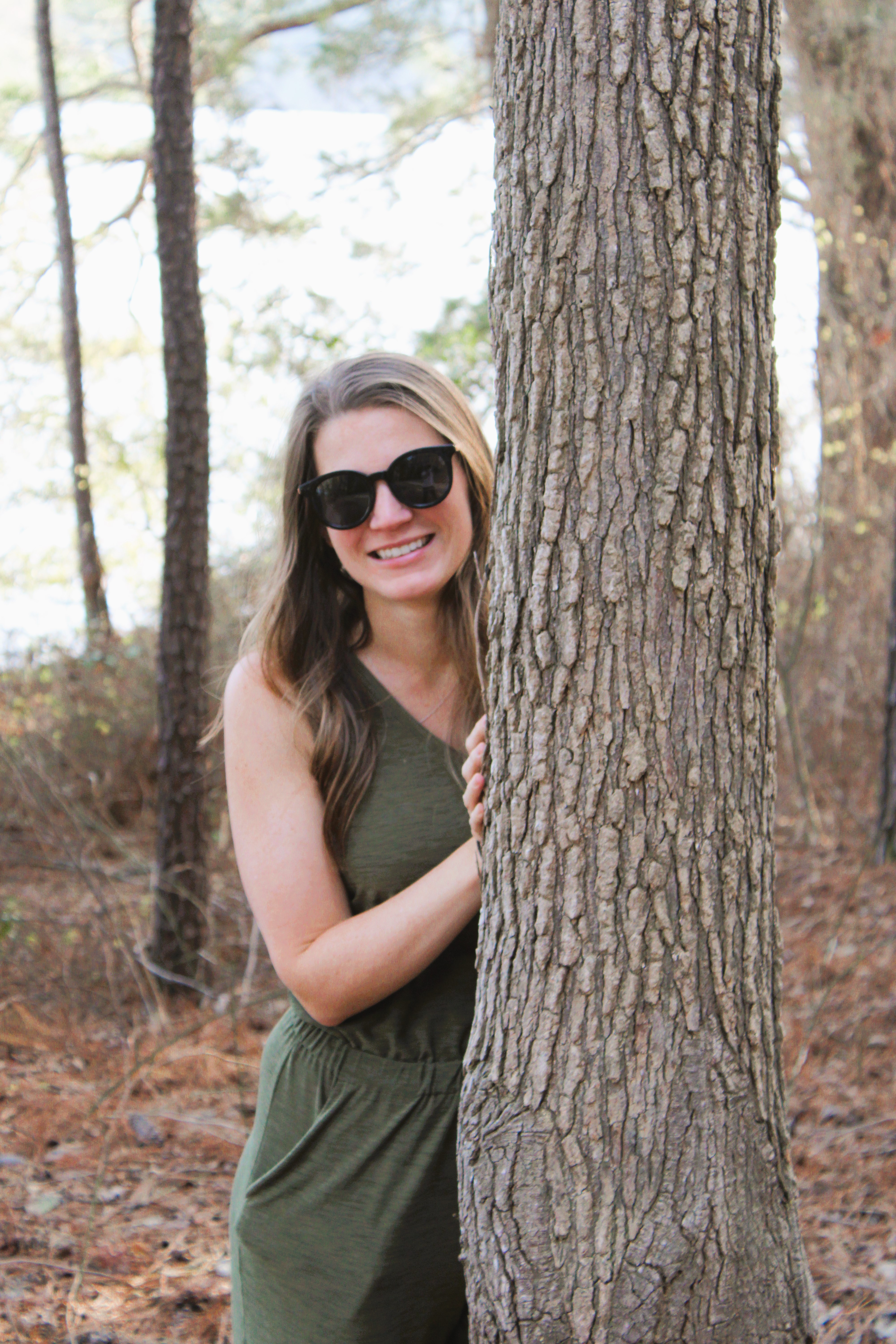 Photo of me standing next to a tree in a park