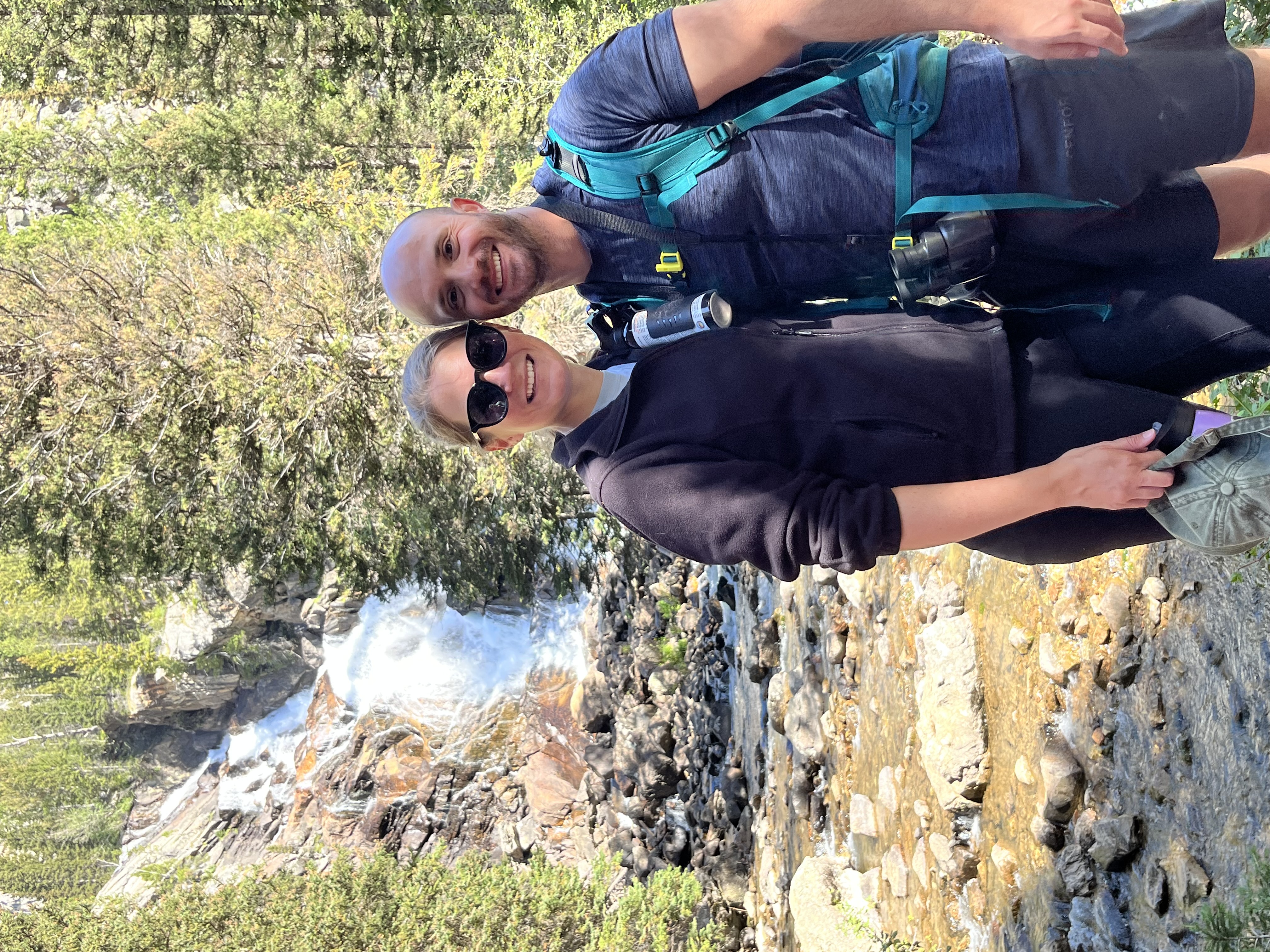 My husband and I posing in front of the Hidden Falls