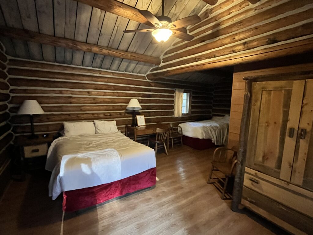 Inside of our cabin at Colter Bay featuring a double bed and a single bed