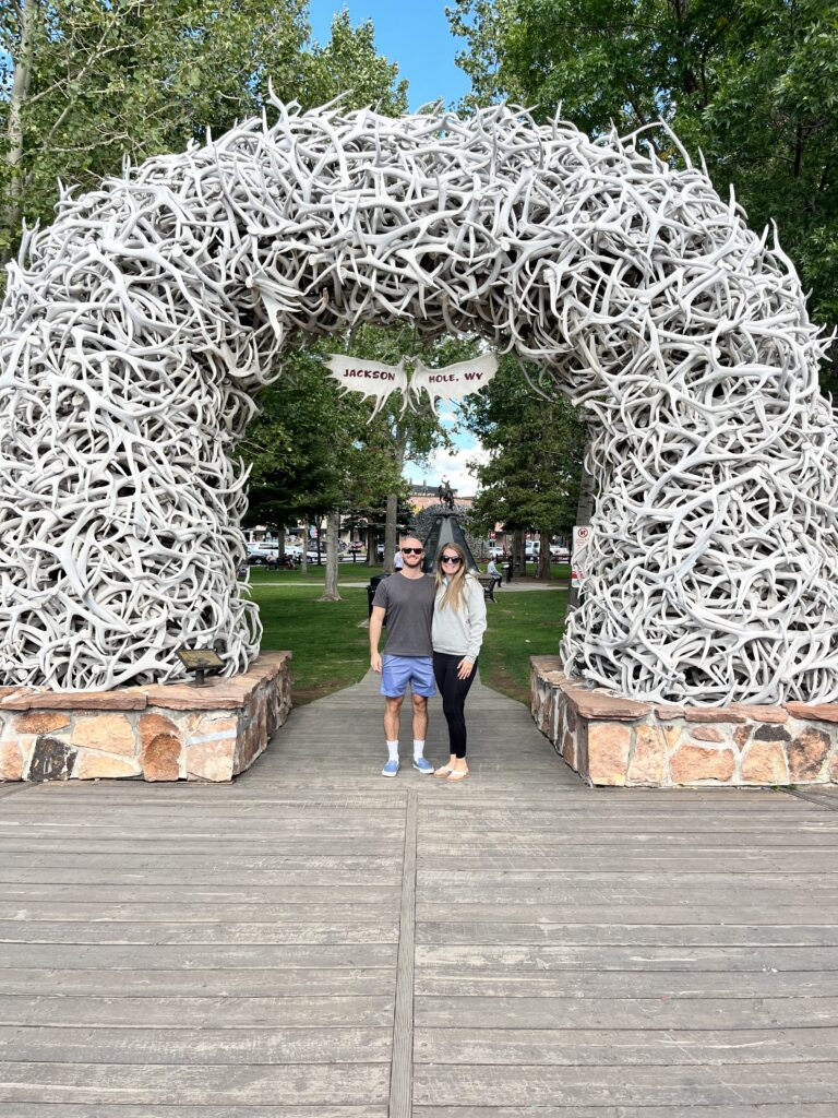 My husband and I standing under the antler arch in Jackson Hole.