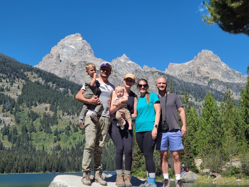 Us and our friends standing on a rock in front of Bradley Lake