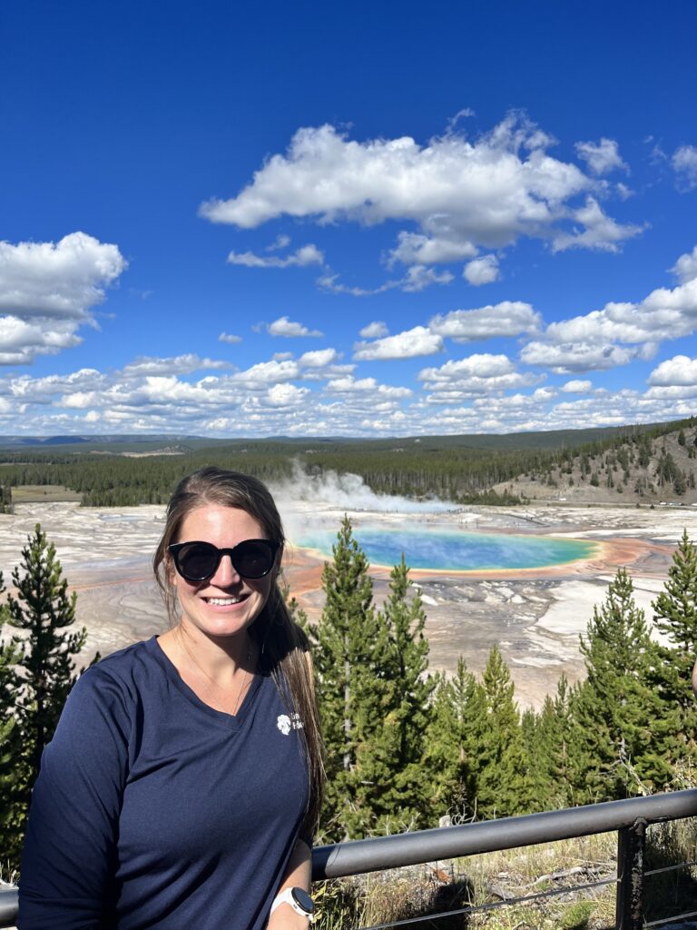 Me standing at the Grand Prismatic Spring overlook