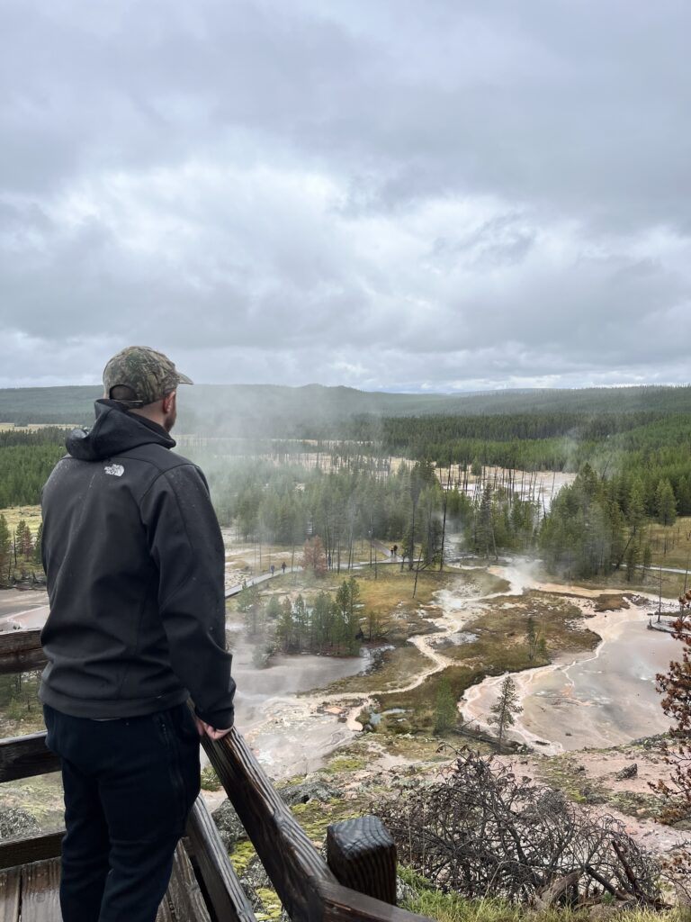 An overlook of Artist Paintpots on a cloudy day in Yellowstone National Park