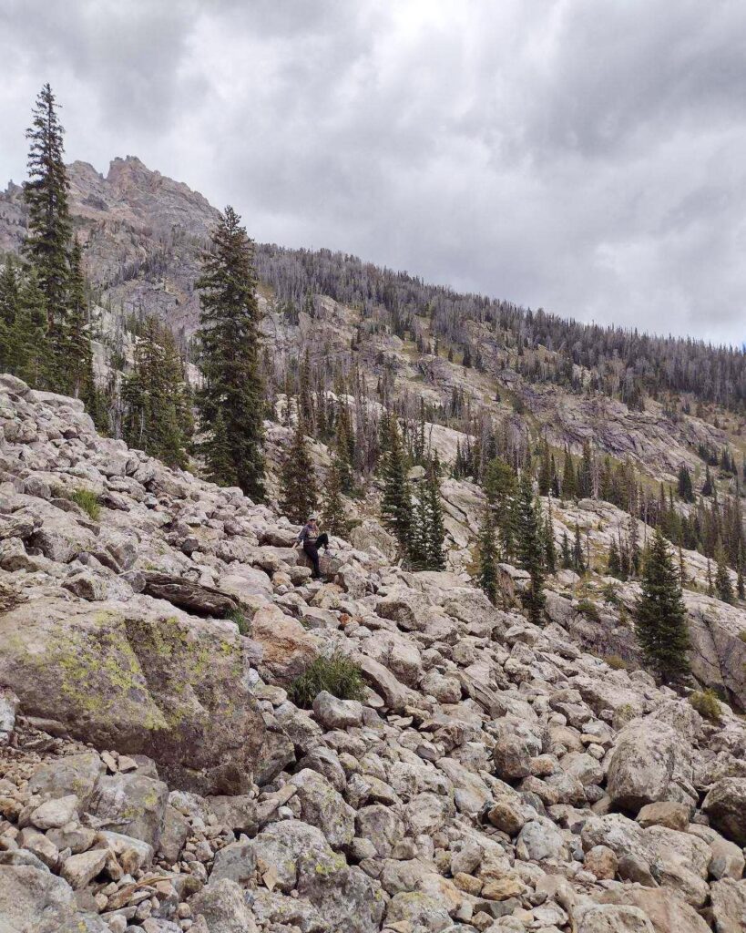 image of me among the rocks for the rock scramble portion of delta lake hike in grand teton national park