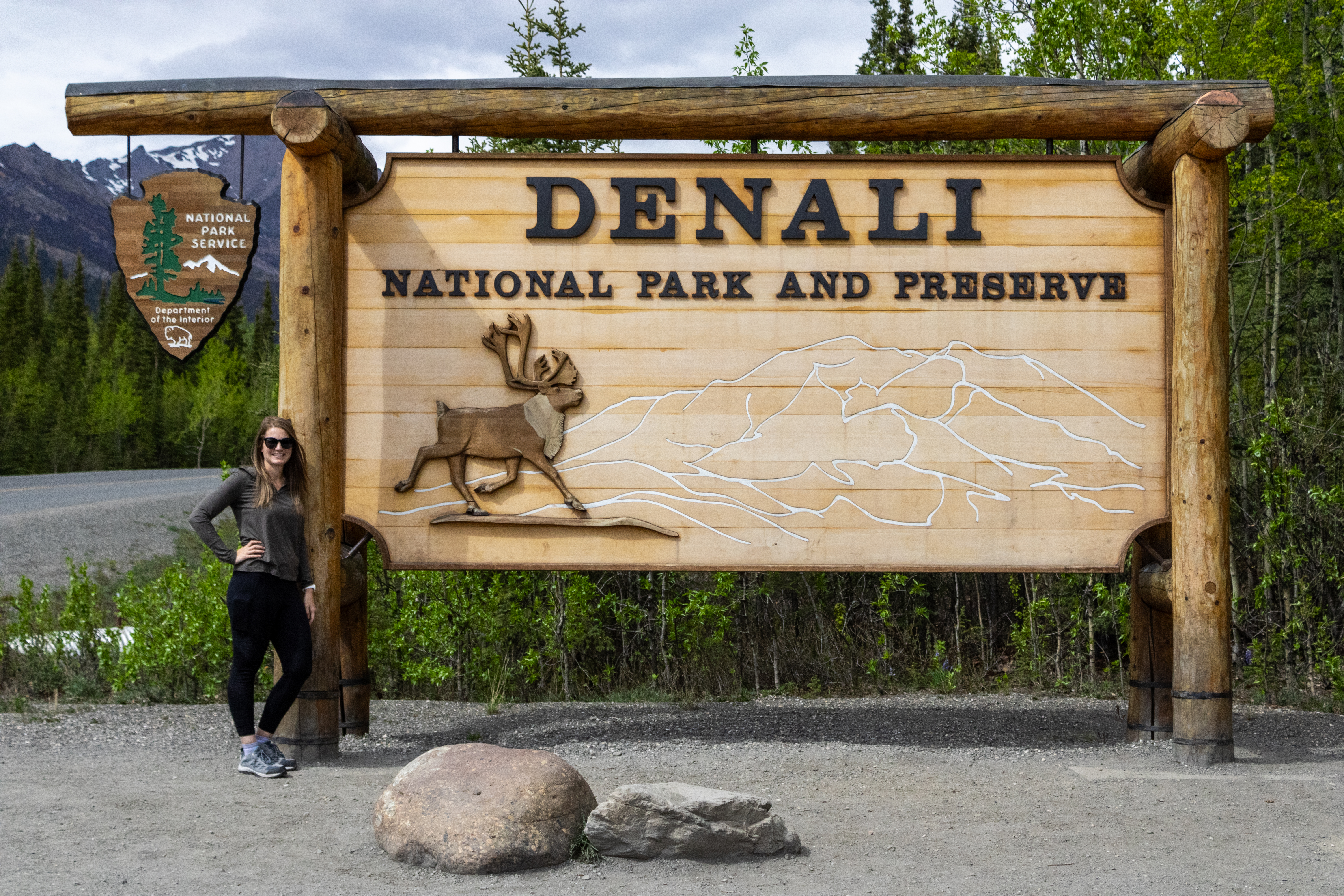 A photo of me standing next to the Denali National Park and Preserve Entrance Sign