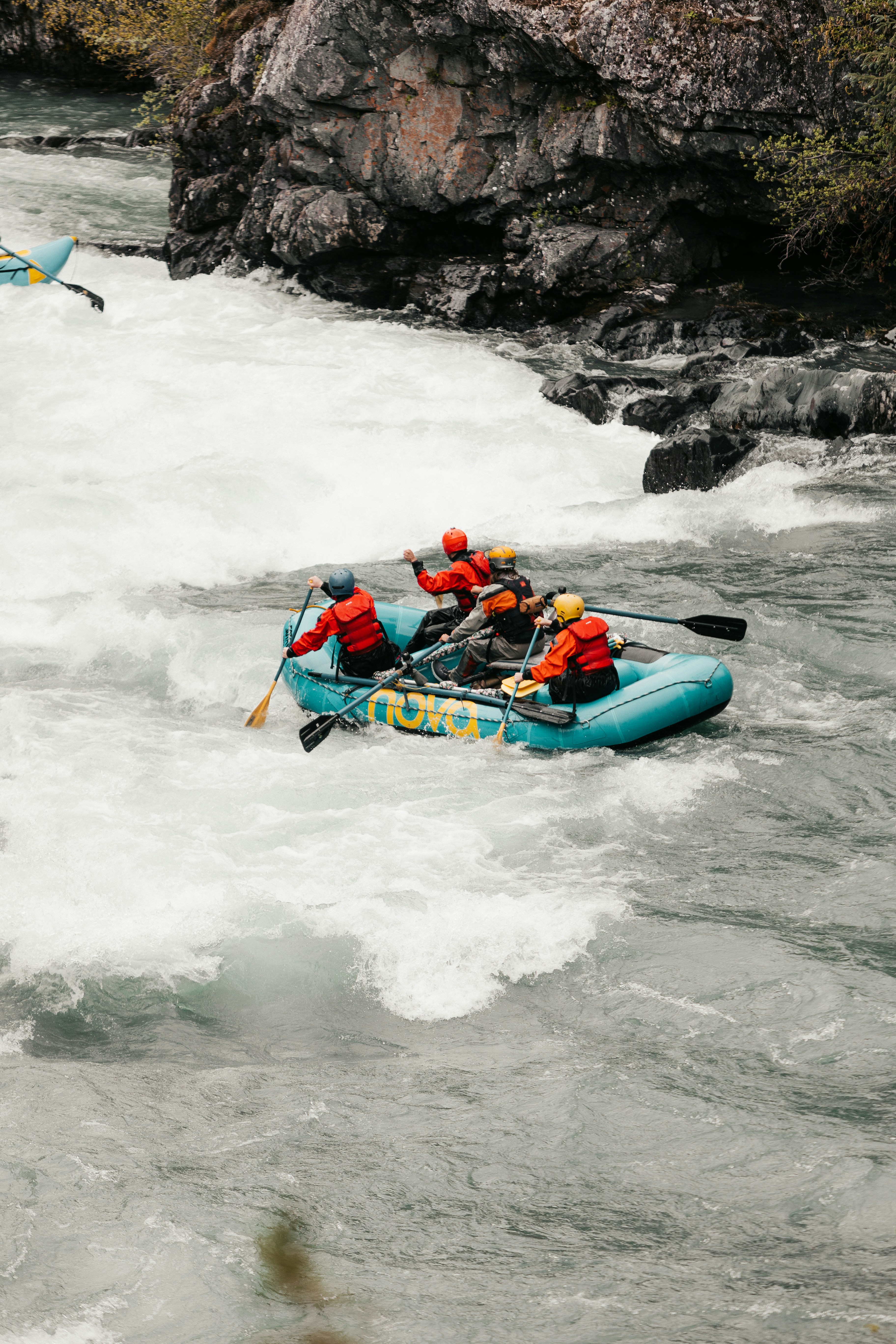 Photo by Andrew varnum on Unsplash of white water rafting in Alaska