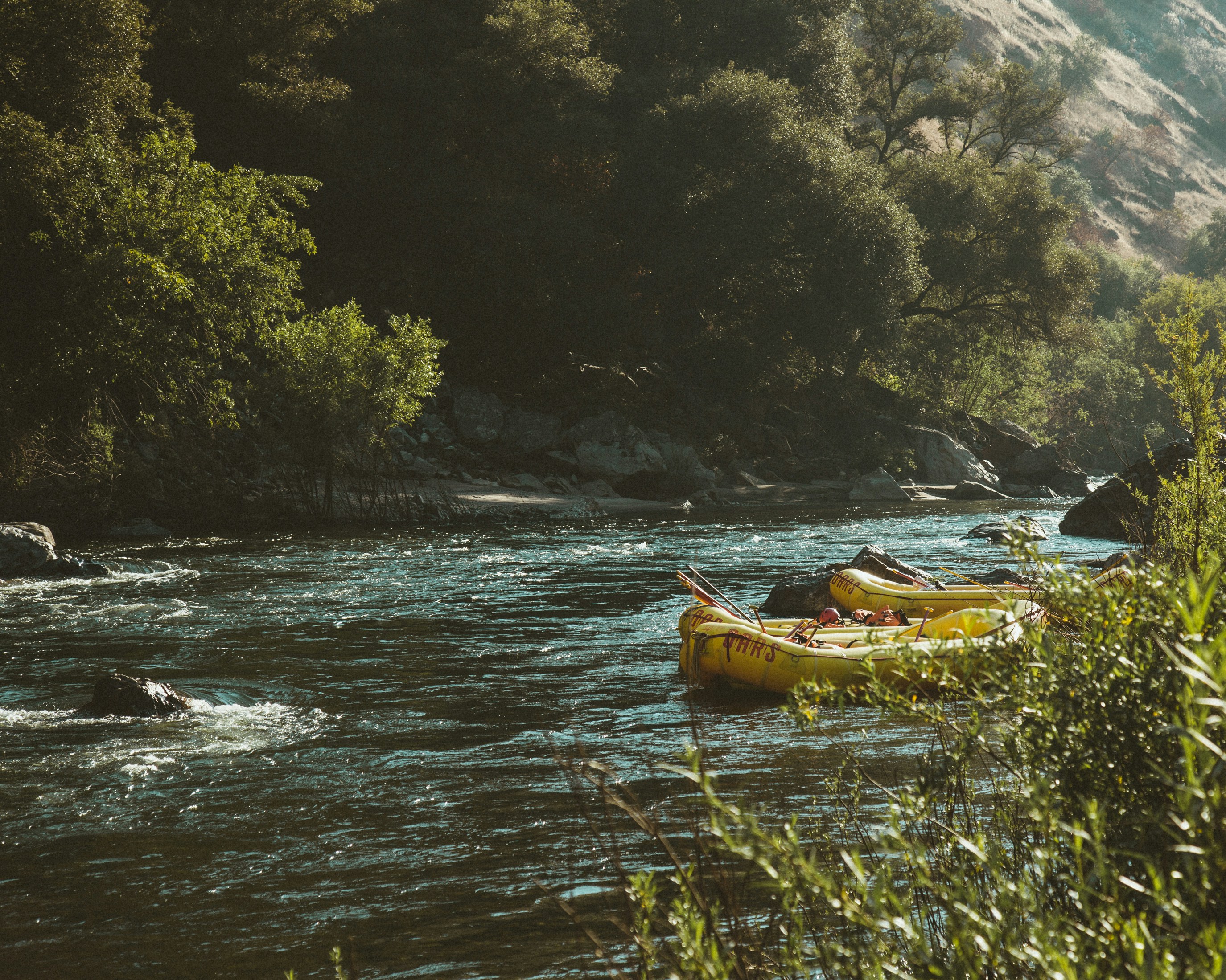 Photo by Dane Deaner on Unsplash of rafts on a river