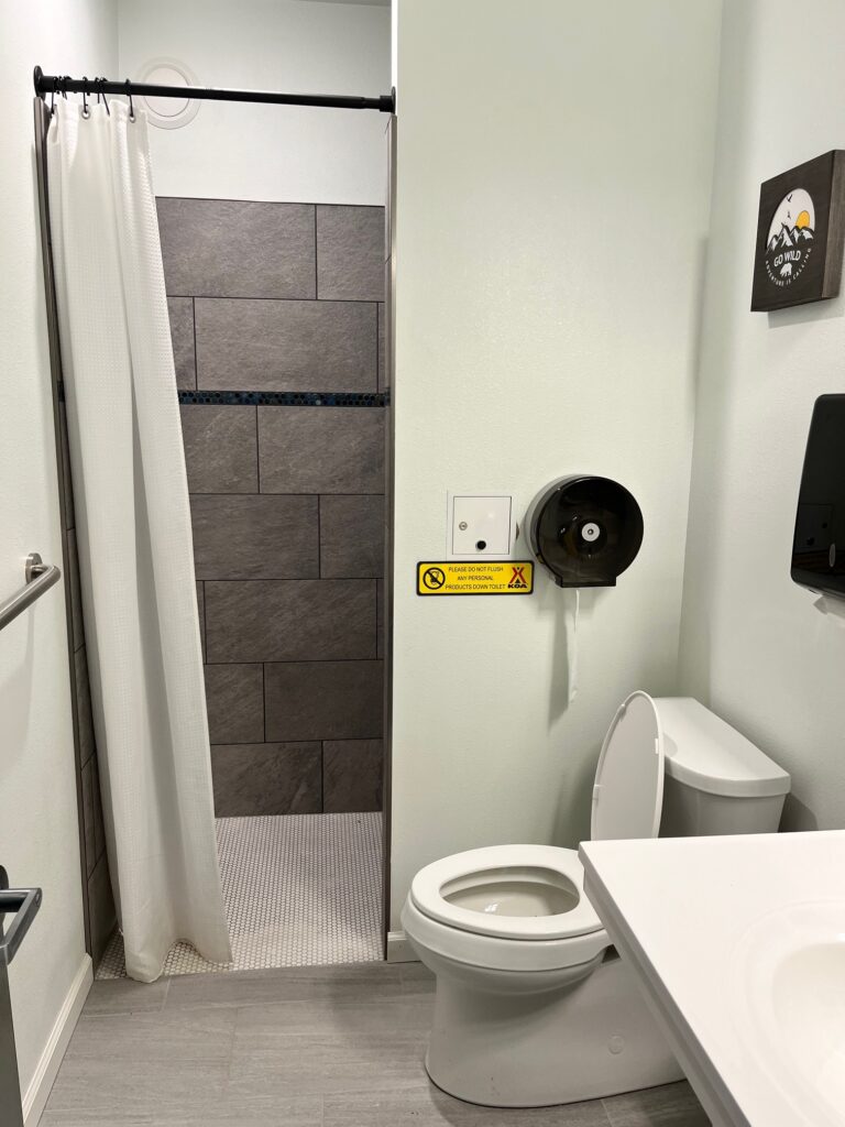 A very clean and modern full bathroom available for guests of the KOA Homer